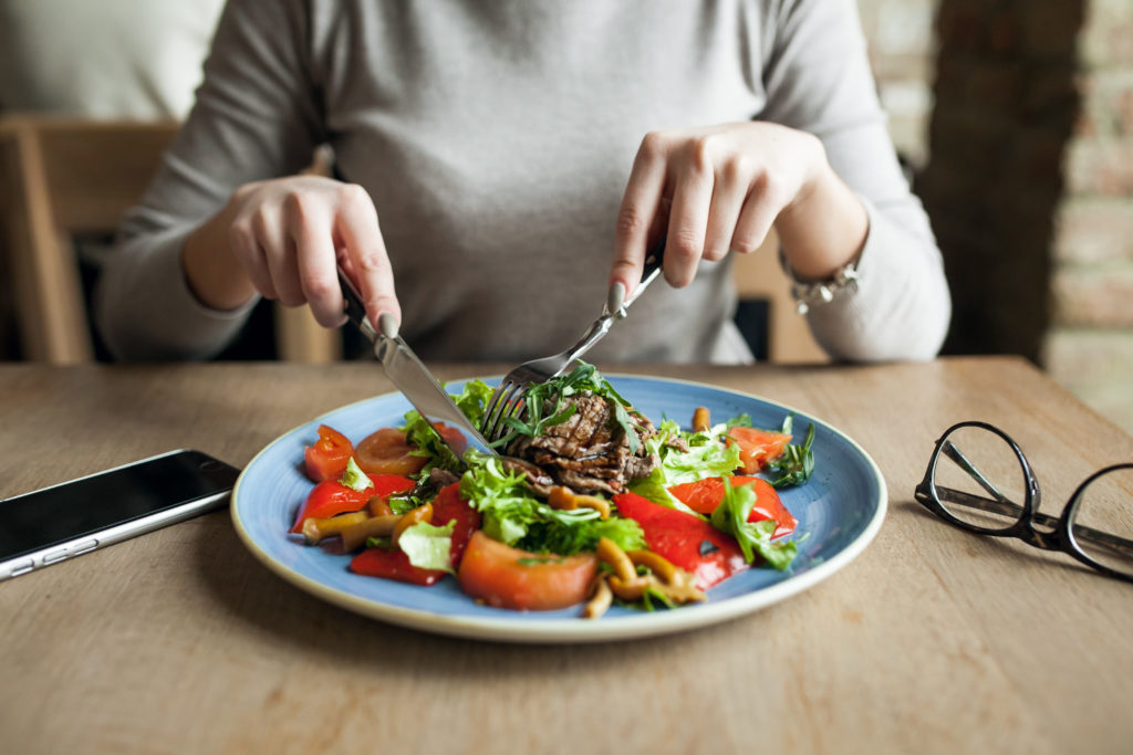 woman eating salad